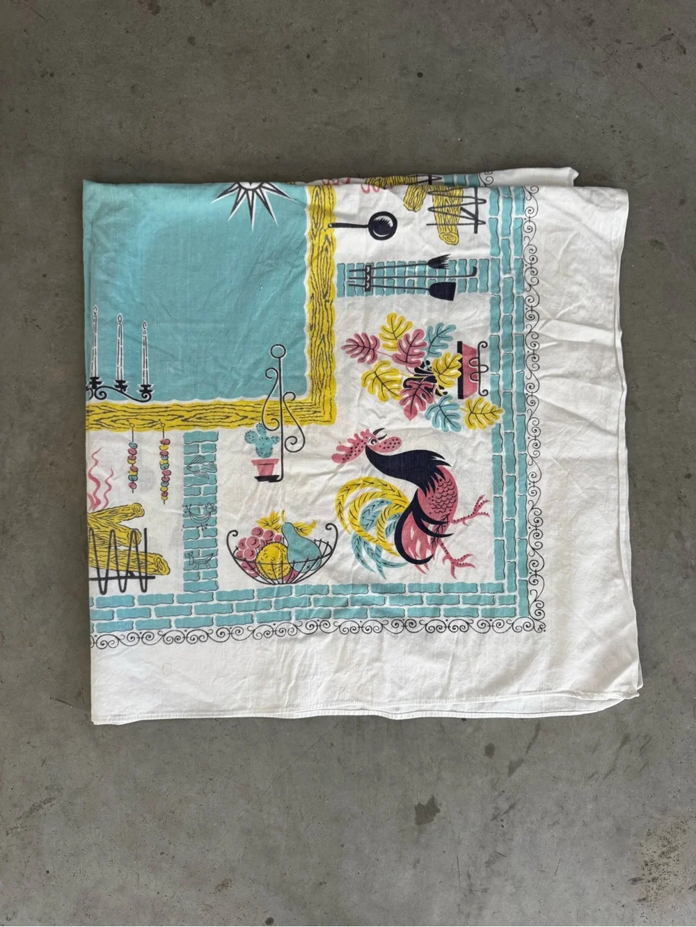 Vintage charming mid-century tablecloth featuring a rooster design with border